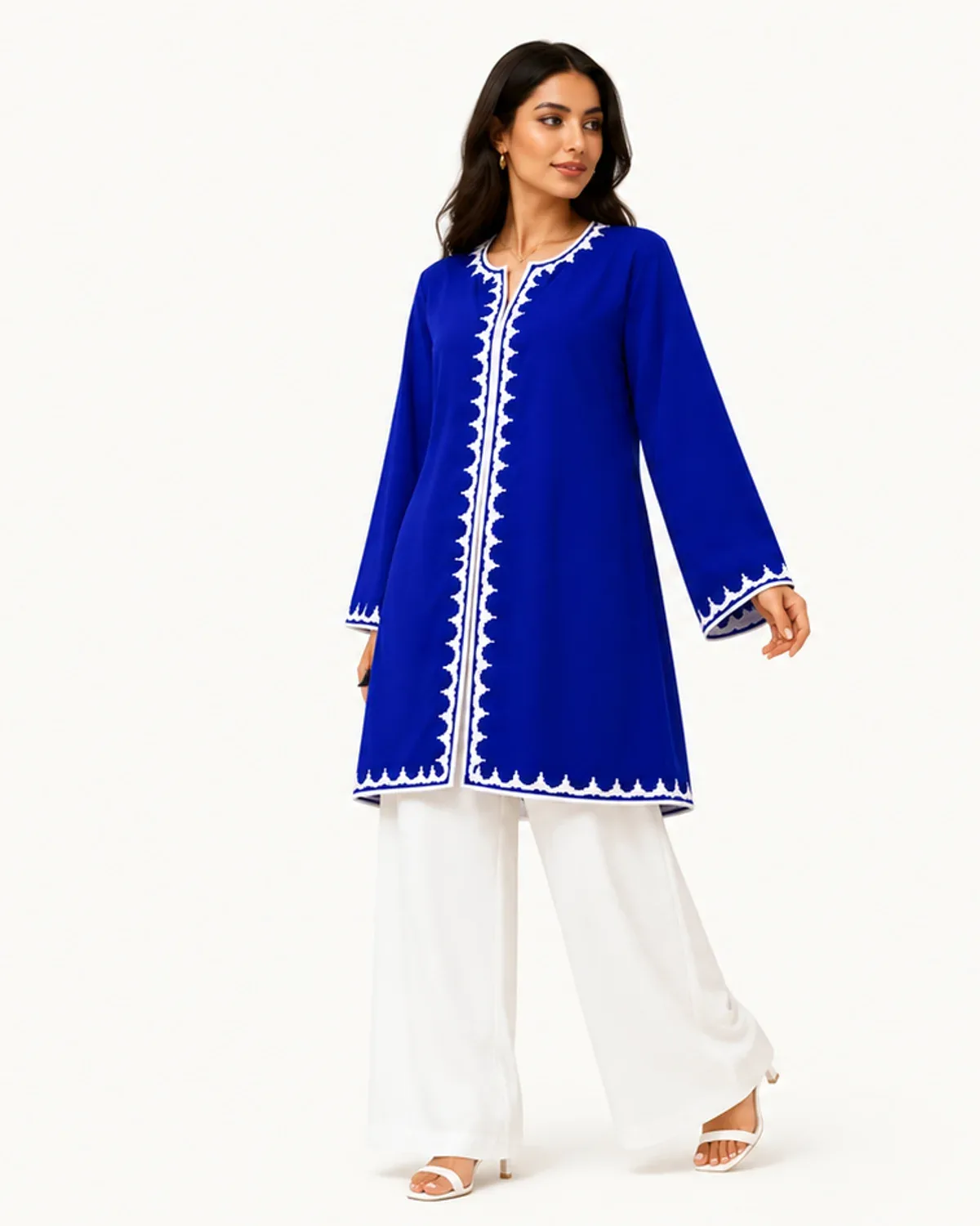Majorelle blue tunic with white scalloped trim over wide white trousers, front view on model
