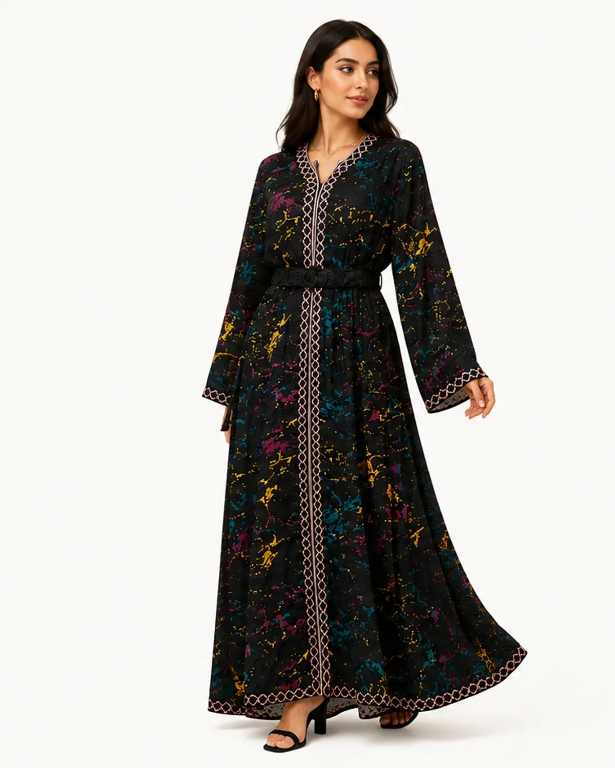 Black belted Moroccan caftan with multicolor print and geometric trim, front view on model
