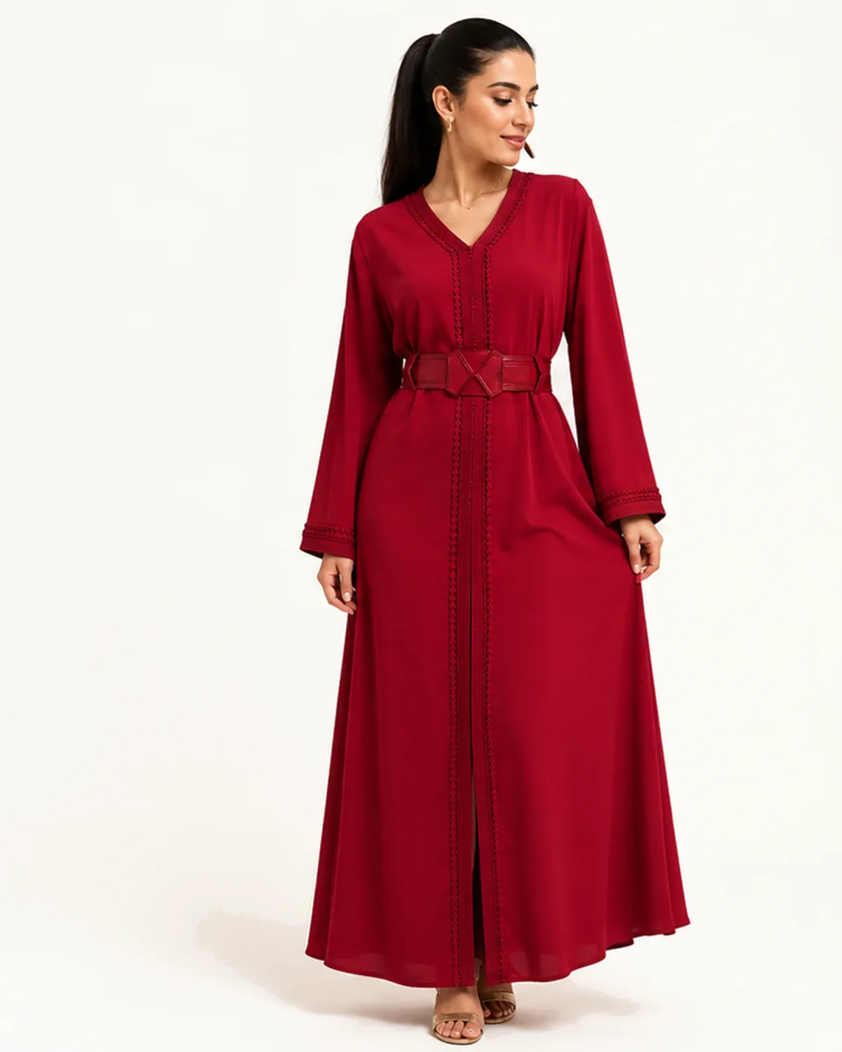 Deep ruby Moroccan caftan with braided trim and structured belt, front view on model